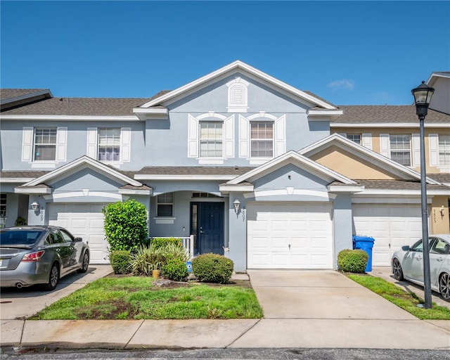 multi unit property featuring a garage