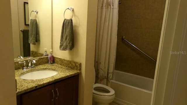 full bathroom with vanity, shower / tub combo with curtain, and toilet