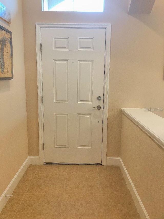 doorway featuring light tile patterned floors