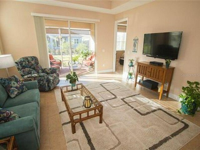 809 Chipper Dr, Sun City Center, FL 33573 - living room with baseboards
