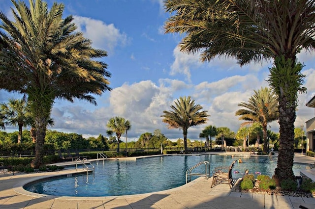 809 Chipper Dr, Sun City Center, FL 33573 - community pool featuring a patio