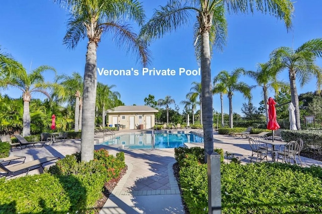 809 Chipper Dr, Sun City Center, FL 33573 - community pool featuring fence and a patio