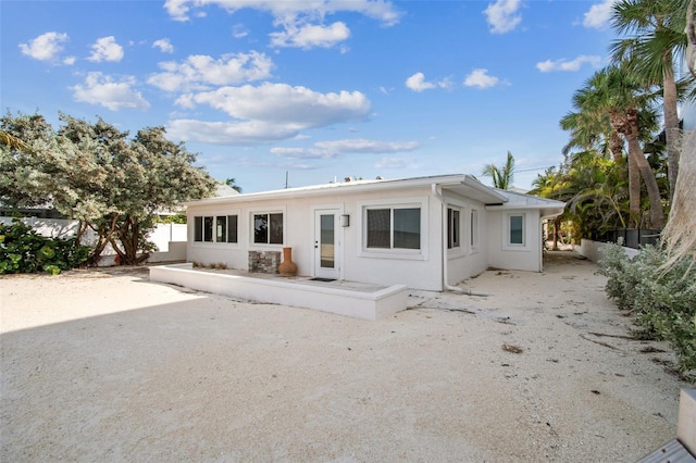 back of property with a patio area