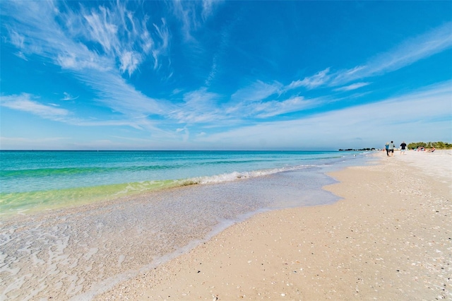 property view of water featuring a beach view