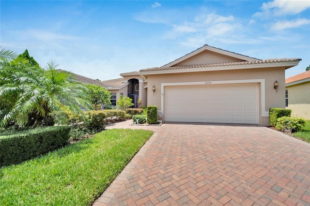 mediterranean / spanish-style home featuring a garage