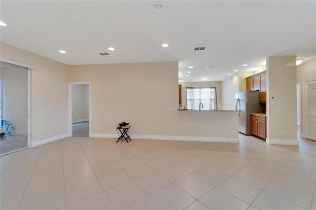 empty room featuring recessed lighting, visible vents, baseboards, and light tile patterned floors