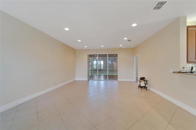 unfurnished room with recessed lighting, light tile patterned flooring, visible vents, and baseboards