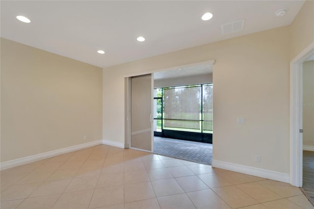 spare room featuring recessed lighting, visible vents, baseboards, and light tile patterned floors