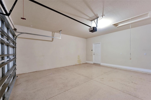 garage with concrete block wall and a garage door opener