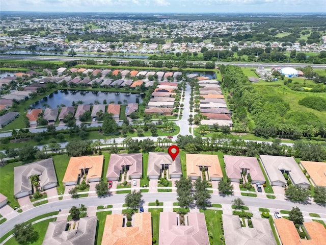 bird's eye view featuring a residential view and a water view