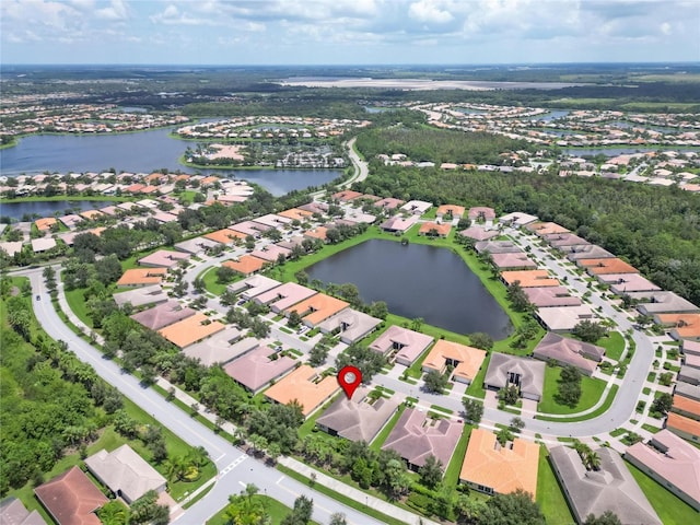 bird's eye view with a residential view and a water view