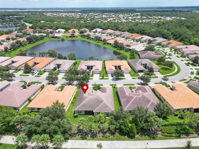 drone / aerial view featuring a water view and a residential view