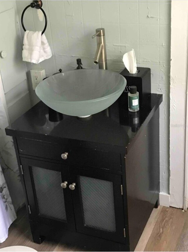 bathroom featuring vanity and hardwood / wood-style flooring