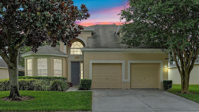 view of front of home featuring a lawn