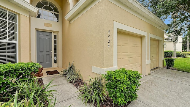 property entrance with a garage