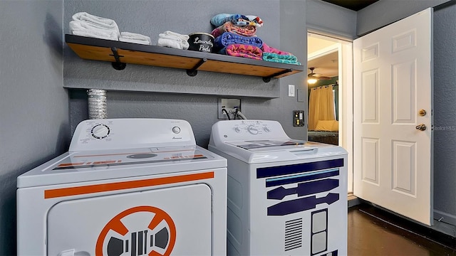 clothes washing area with washing machine and clothes dryer