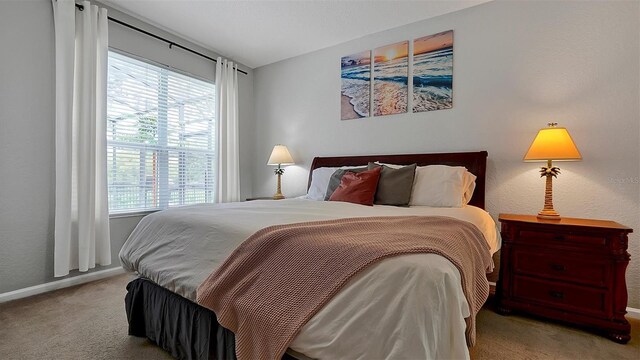 bedroom featuring light carpet