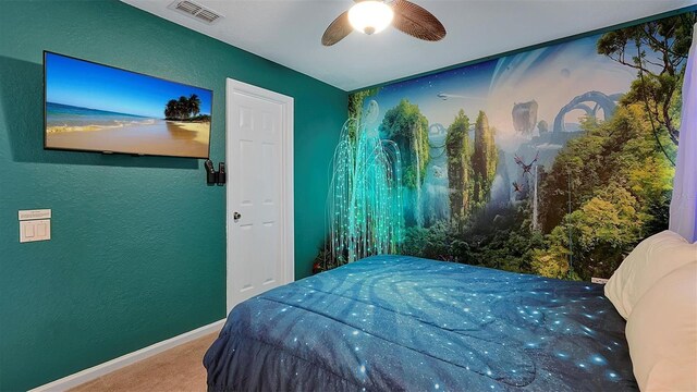 bedroom with ceiling fan and carpet