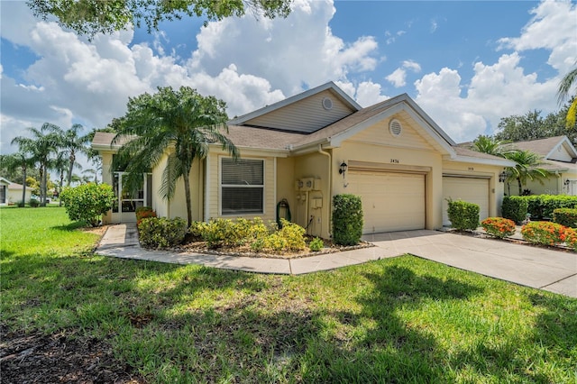 ranch-style house featuring a front yard, concrete driveway, an attached garage, and stucco siding