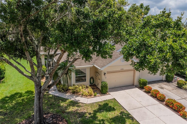 view of front facade with a front yard and a garage