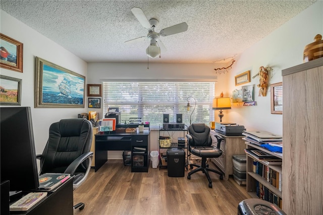 office space with ceiling fan, a textured ceiling, and hardwood / wood-style flooring