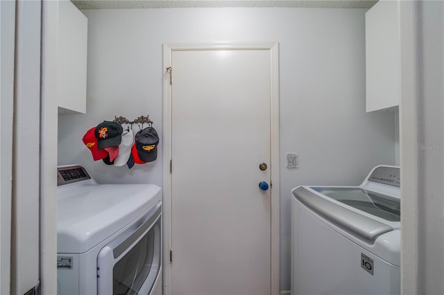 laundry area with separate washer and dryer