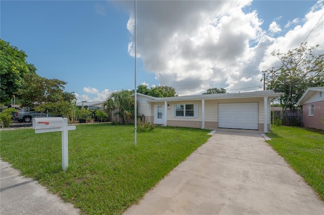 single story home featuring a garage and a front lawn