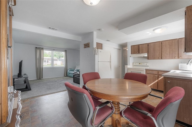 view of carpeted dining room