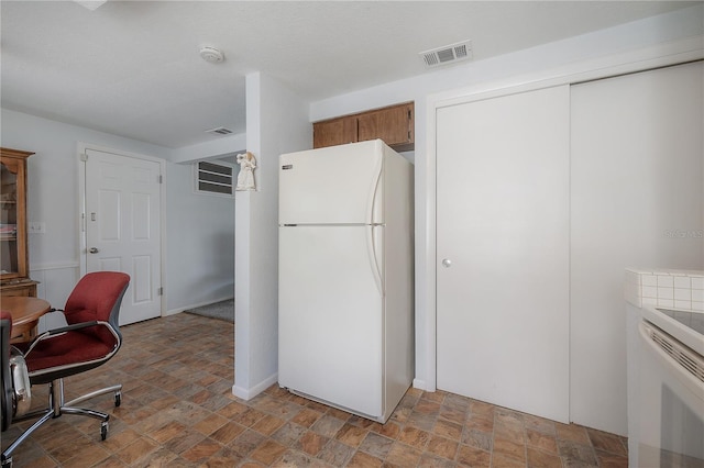 kitchen featuring white refrigerator