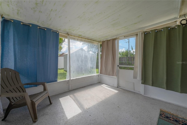 unfurnished sunroom with plenty of natural light