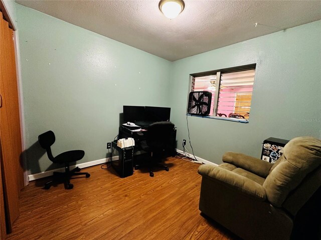 office area featuring a textured ceiling and hardwood / wood-style floors