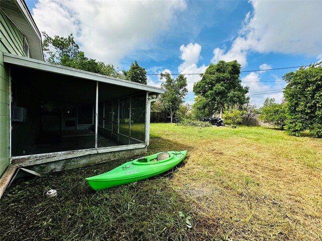 view of yard featuring a sunroom