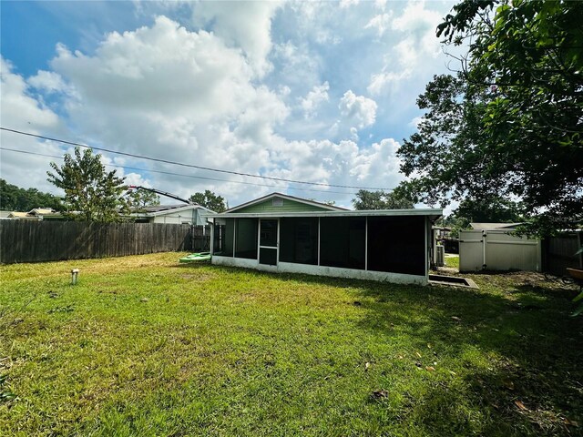 view of yard featuring a sunroom