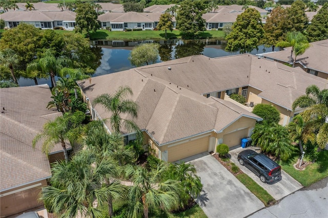 bird's eye view featuring a water view and a residential view