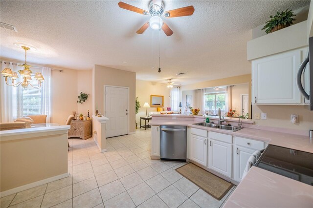 kitchen featuring light tile patterned flooring, white cabinets, ceiling fan with notable chandelier, and stainless steel dishwasher