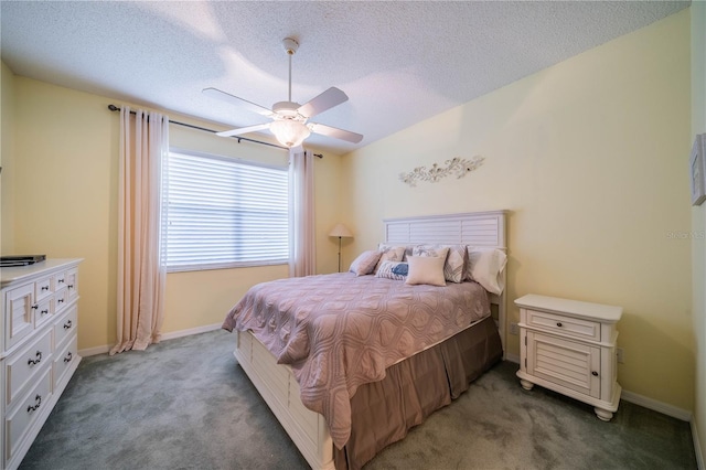 carpeted bedroom with ceiling fan and a textured ceiling