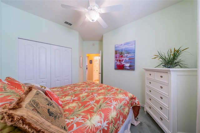 bedroom featuring ceiling fan, a closet, and carpet