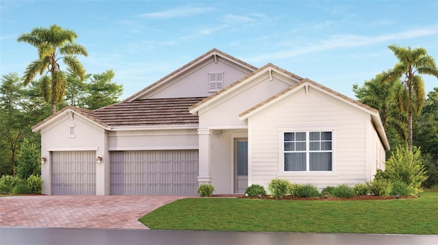 view of front of house with a front yard and a garage