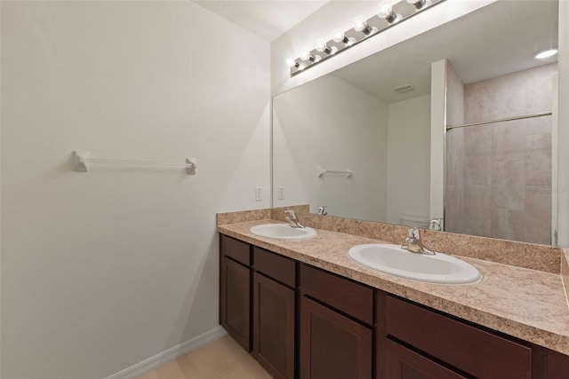 bathroom featuring double sink vanity and tile patterned flooring