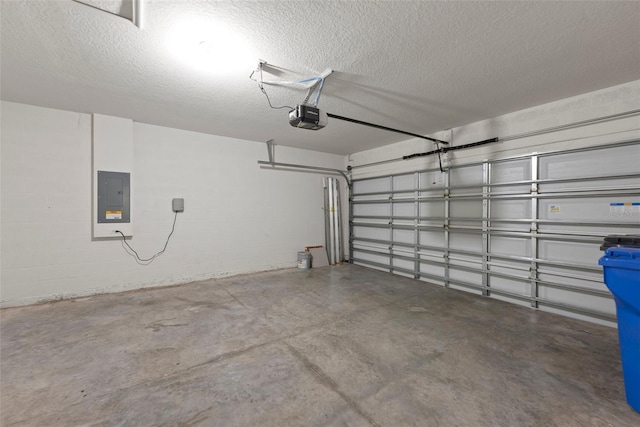 garage with electric panel and a garage door opener