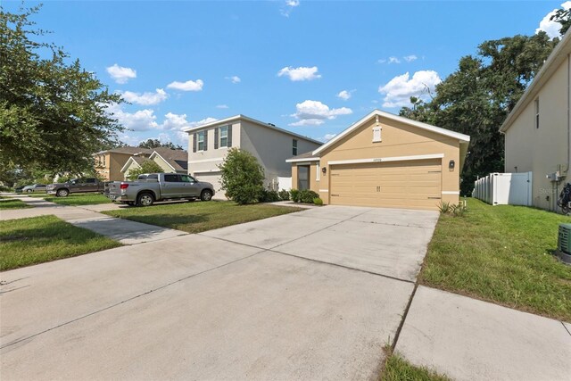 view of front facade featuring a garage and a front lawn