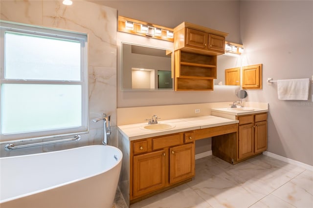 bathroom with vanity and a bath