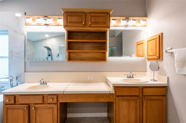 bathroom with a shower and vanity