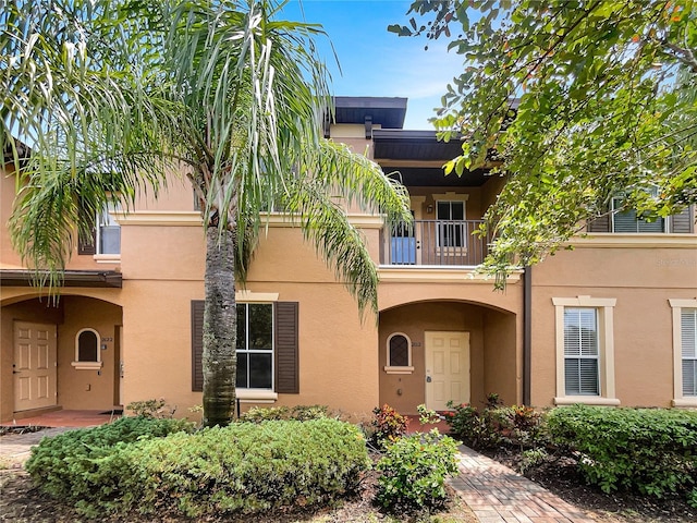 view of front of property with a balcony