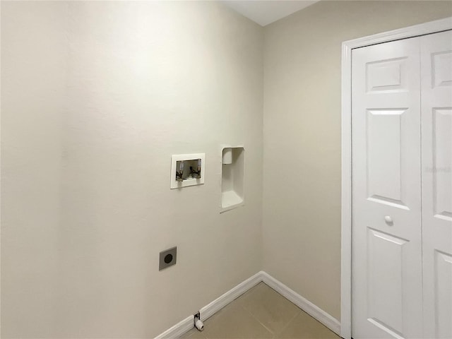 clothes washing area featuring hookup for a washing machine, hookup for an electric dryer, and tile patterned floors