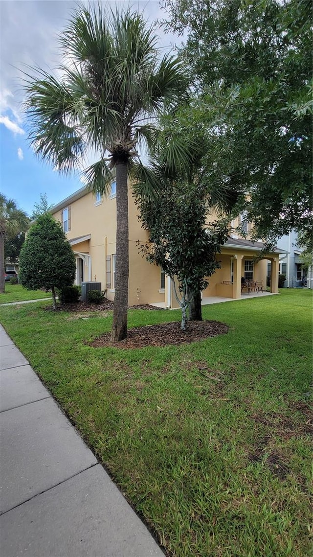 view of property exterior featuring a yard