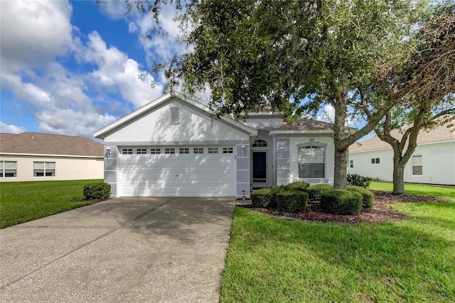 ranch-style home with a front yard and a garage