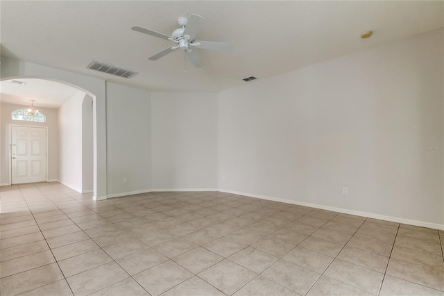 unfurnished room featuring light tile patterned floors and ceiling fan