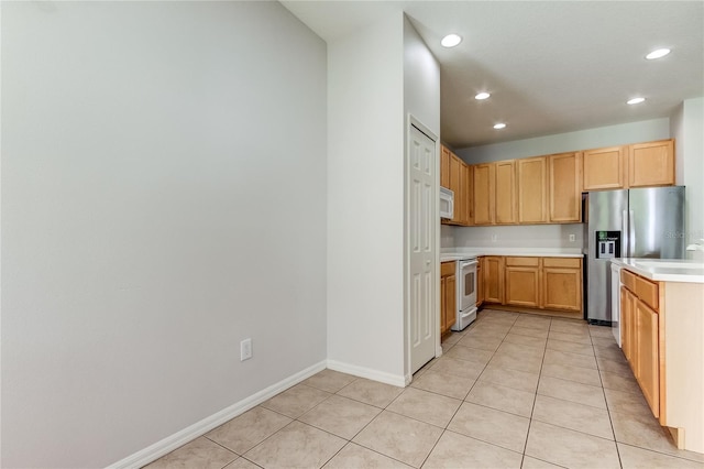 kitchen featuring stove, light brown cabinetry, light tile patterned floors, and stainless steel fridge with ice dispenser