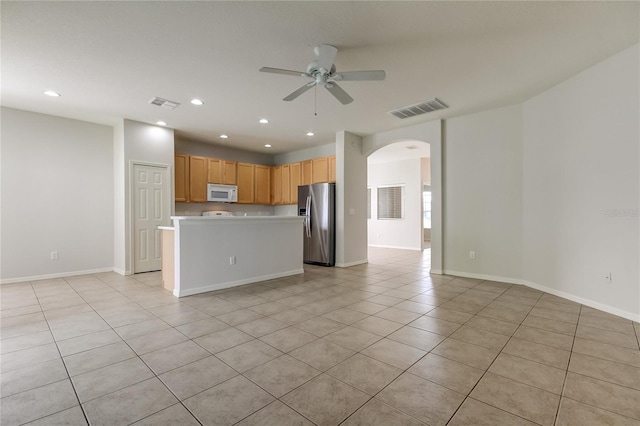 kitchen featuring stainless steel fridge with ice dispenser, light tile patterned flooring, and ceiling fan